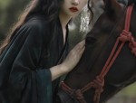 The Enigma of a Black Tang Suit Woman
