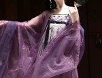 The Allure of Sleeveless Cheongsam with a Cape-like Jacket