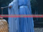 A Little Girl in a Blue Tang Suit:Embracing Traditional Elegance