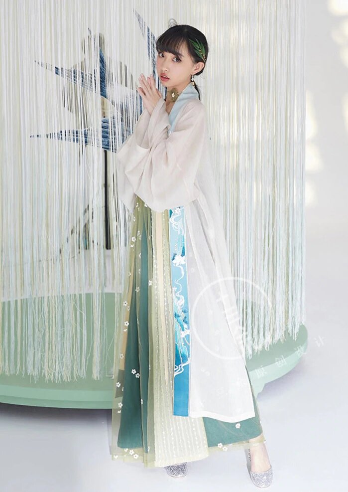 Embracing Summer in a Cheongsam with Shawl and Light Jacket Embracing Summer in a Cheongsam with Shawl and Light Jacket