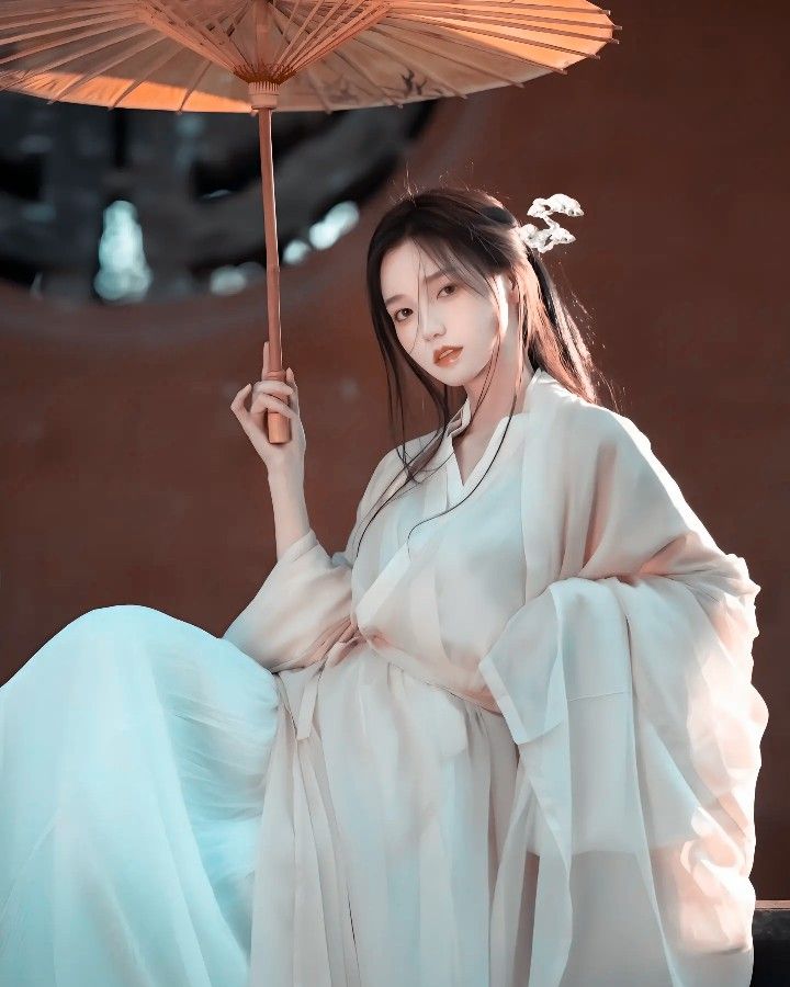 The Elegance of Cheongsam with Long Overcoat and Open Cardigan The Elegance of Cheongsam with Long Overcoat and Open Cardigan